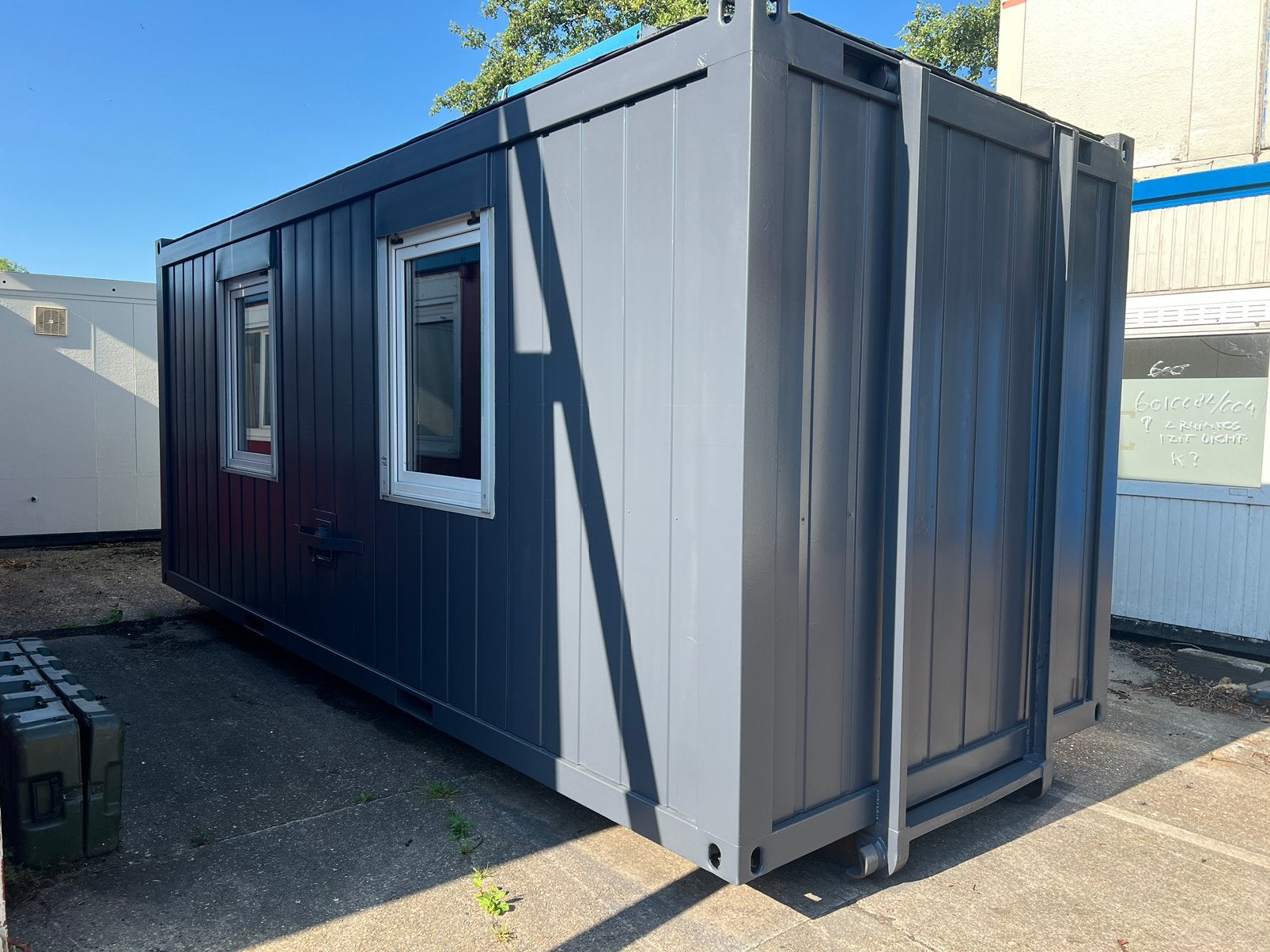 Kantoorunit 20 ft met optrek slede, Ophalen