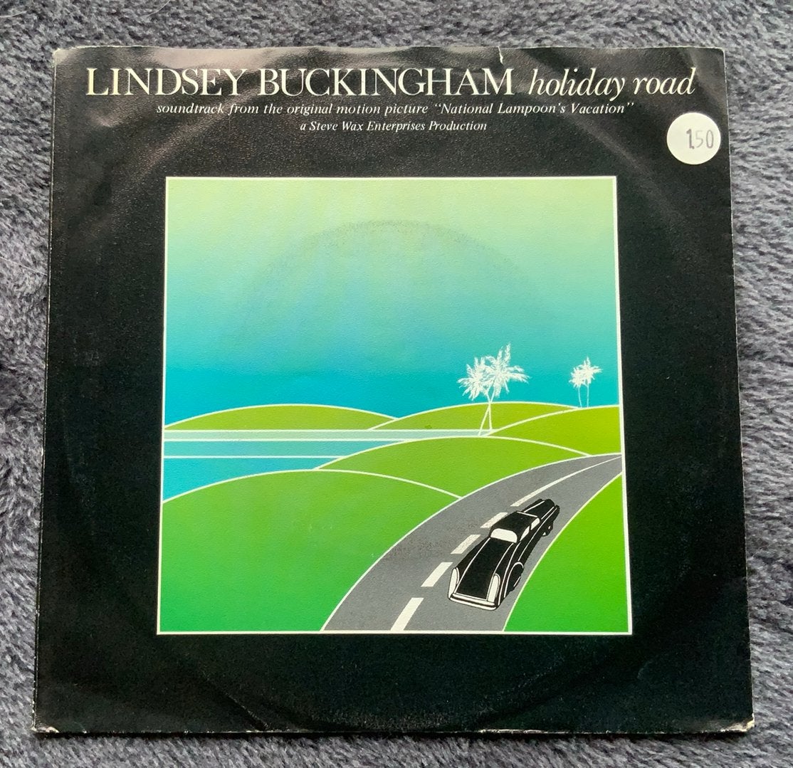 VINYL 7” SINGLE LINDSEY BUCKINGHAM HOLIDAY ROAD 1983 MERCURY, Cd's en Dvd's, Vinyl Singles, Gebruikt, Fotohoes, Originele persing