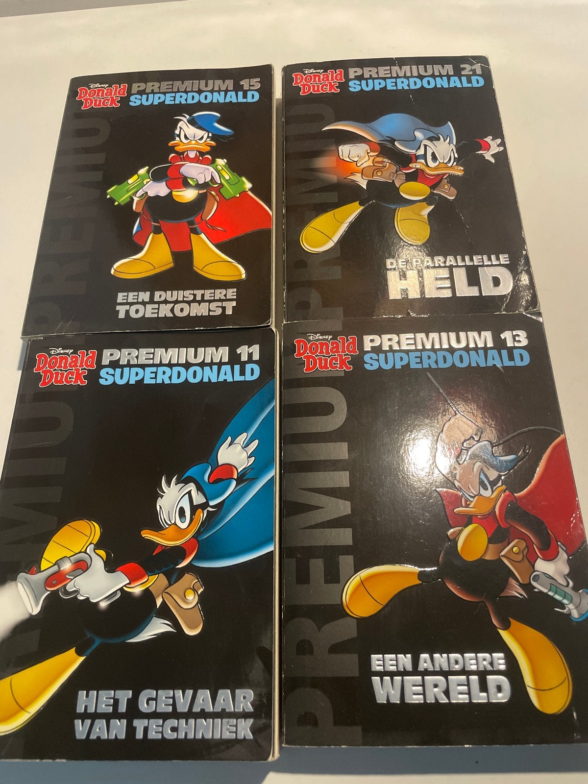 Donald Duck Premium Superdonald Boeken Nrs. 11, 13, 15, 22, Meerdere stripboeken, Ophalen of Verzenden, Gelezen