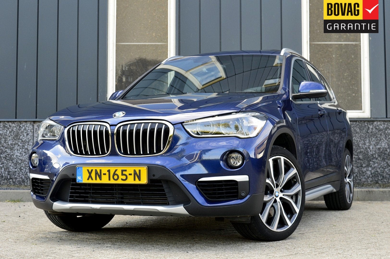 BMW X1 sDrive20i Orange Edition III Rijklaarprijs-Garantie P, Auto's, Blauw, Bedrijf, Automatische klimaatregeling, SUV of Terreinwagen