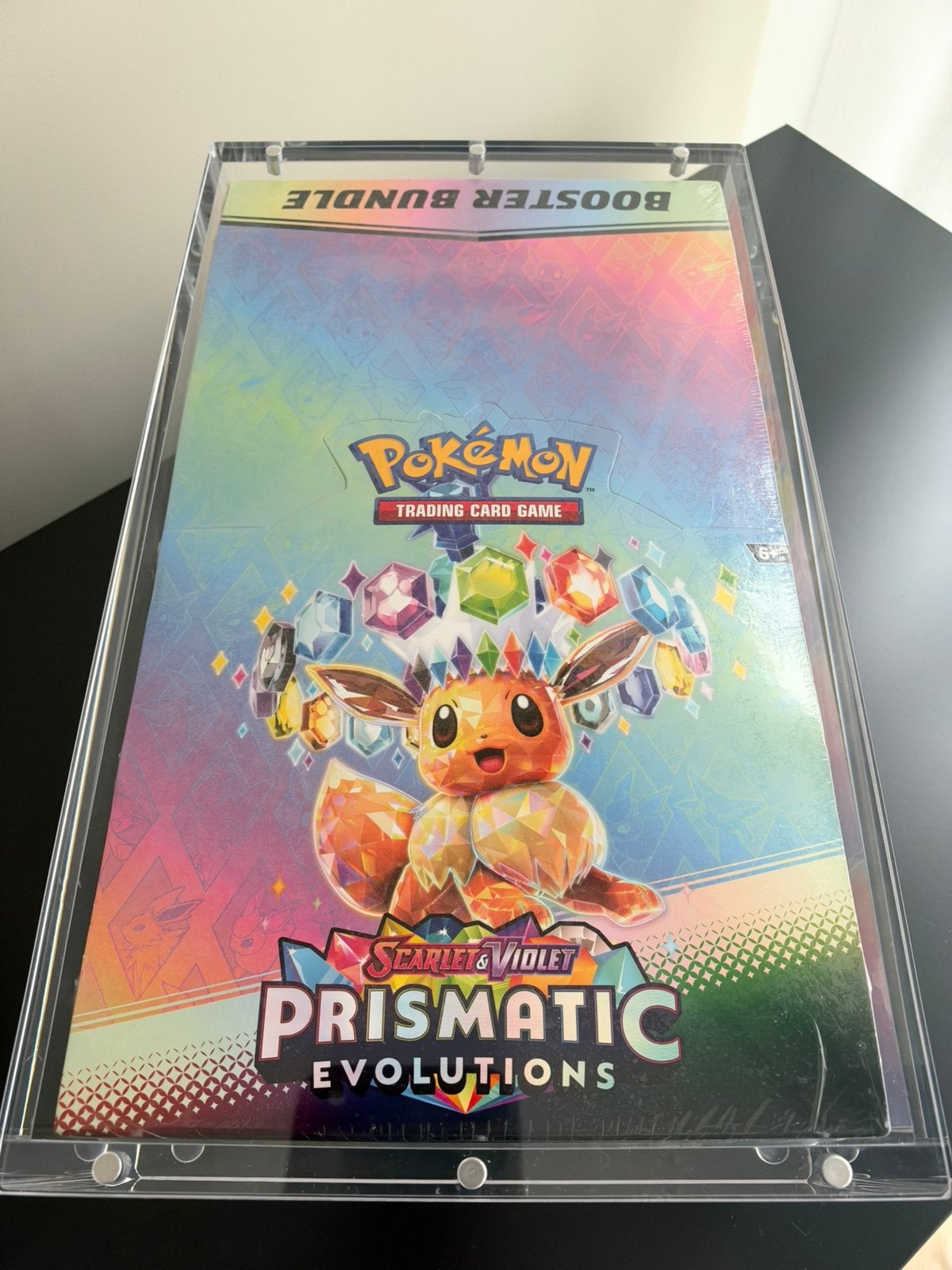 PRISMATIC EVOLUTIONS BOOSTER BUNDLE DISPLAY INCL ACRYLIC, Ophalen of Verzenden, Zo goed als nieuw, Booster