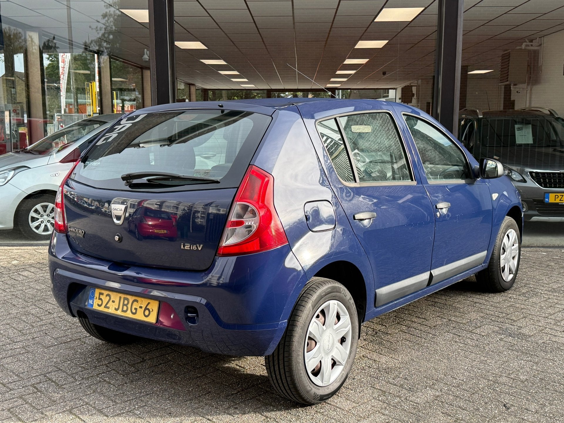 Dacia Sandero 1.2 5drs Ambiance AIRCO | ELEKTR PACK | NAP, Auto's, Voorwielaandrijving, Stof, Gebruikt, Blauw