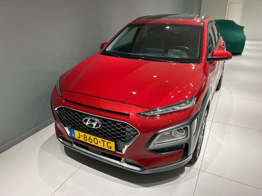 HYUNDAI Kona GDI 141pk HEV 2WD Automaat Premium Sky Unieke K, Auto's, Hyundai, Automaat, 12 maanden, Gebruikt, Leder en Stof