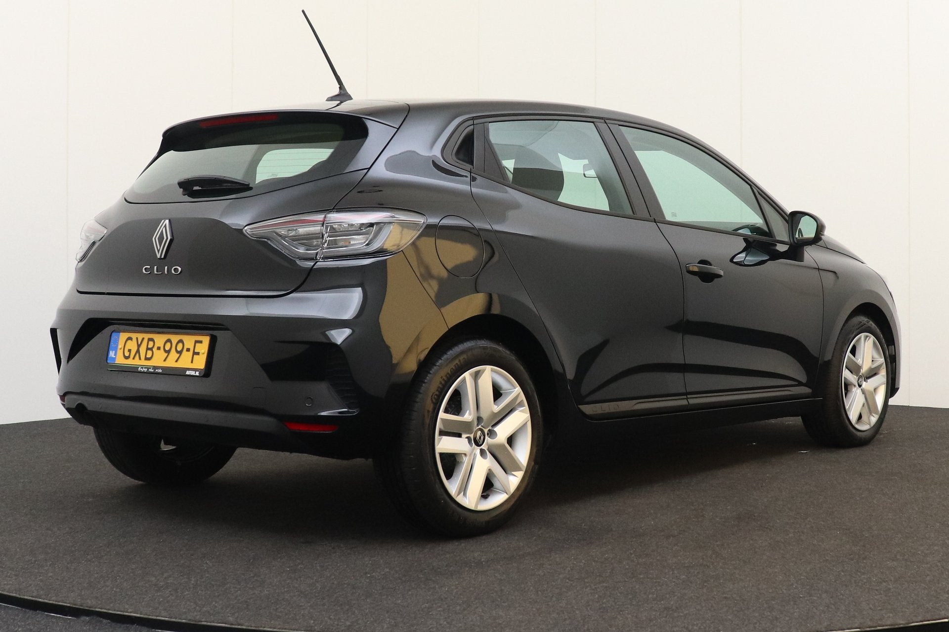 Renault Clio 1.0 TCe 92 PK Evolution Half-Leder/Sportstoelen, Auto's, Voorwielaandrijving, Gebruikt, Leder en Stof, Zwart