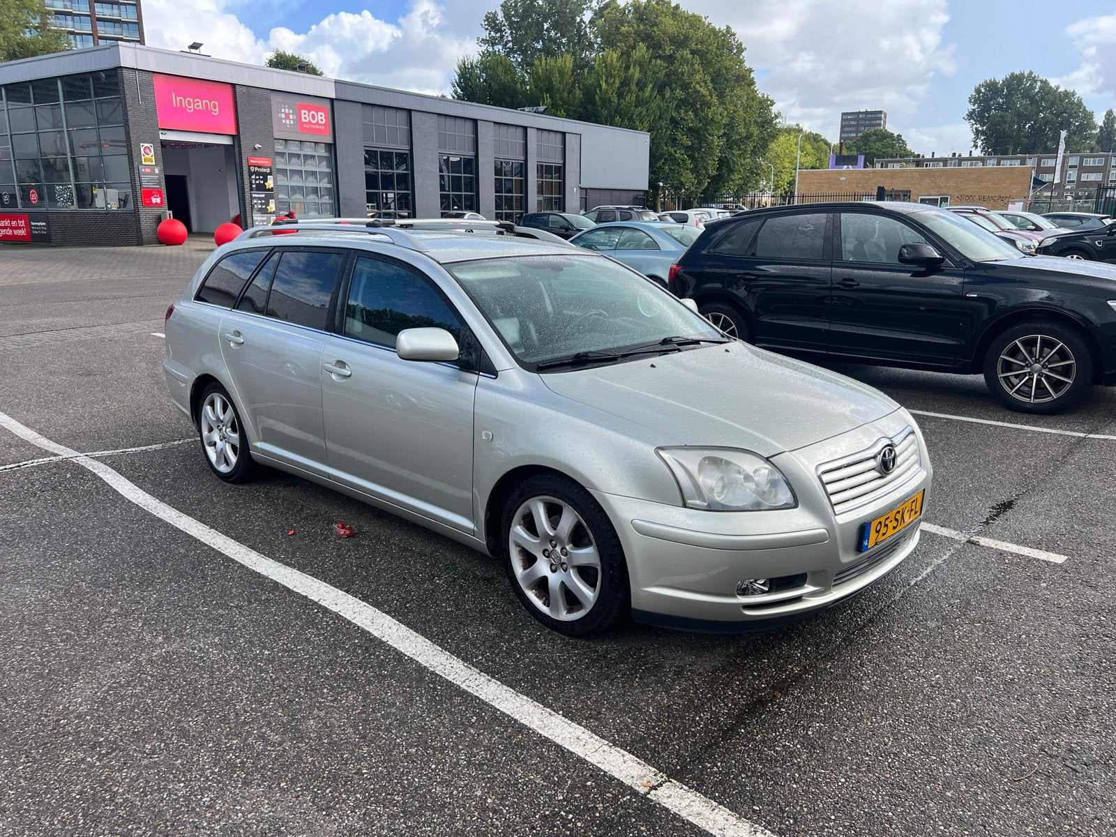 Toyota Avensis 2.4 16V WGN Linea Luna AUT 2006 Grijs, Auto's, Avensis, 4 cilinders, 163 pk, Zilver of Grijs