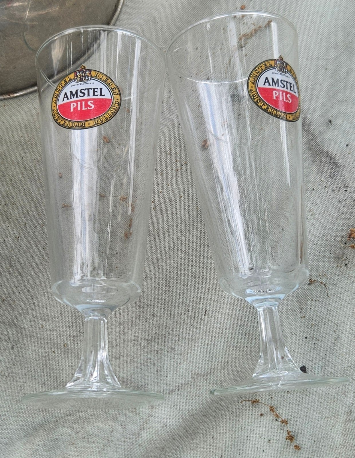 2 amstel glazen op voetje, Ophalen of Verzenden, Zo goed als nieuw, Glas of Glazen, Amstel