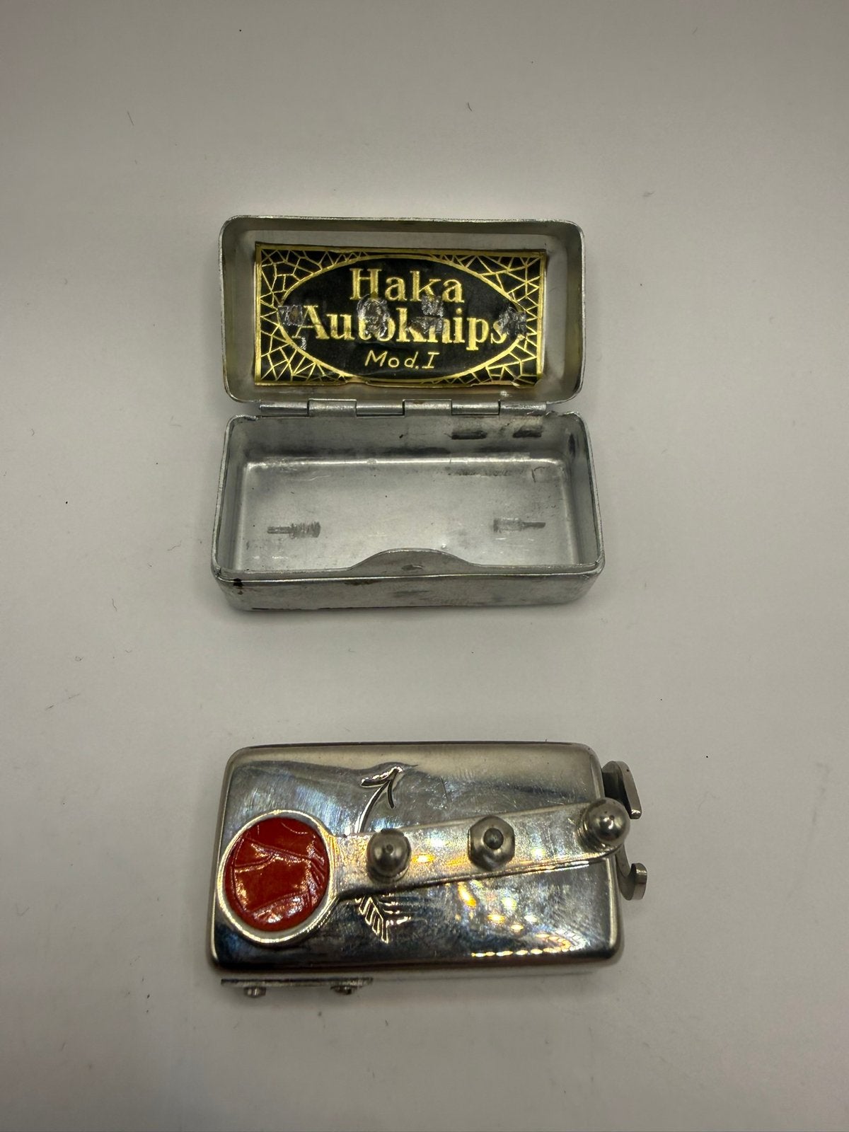 Haka Autoknips Mod. vintage zelfontspanner + metalen doosje, Ophalen of Verzenden
