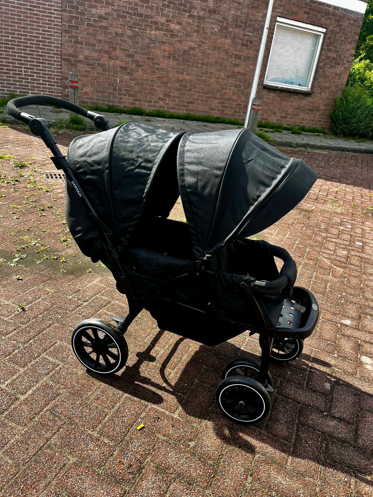 Opvouwbare dubbele buggy deryan, Ophalen of Verzenden, Zo goed als nieuw, Overige merken