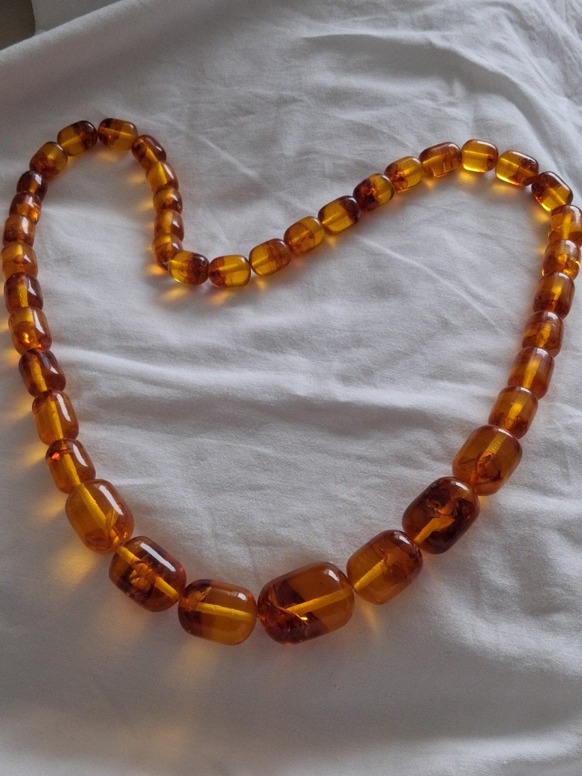 Barnsteen (Ambroid)geperst 70 cm 90 gram, Ophalen of Verzenden, Overige materialen, Ketting