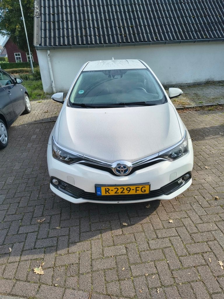 Toyota Auris 1.8 Hybrid 5DR CVT 2017 Wit, Auto's, Stof, Wit, Auris, 1285 kg