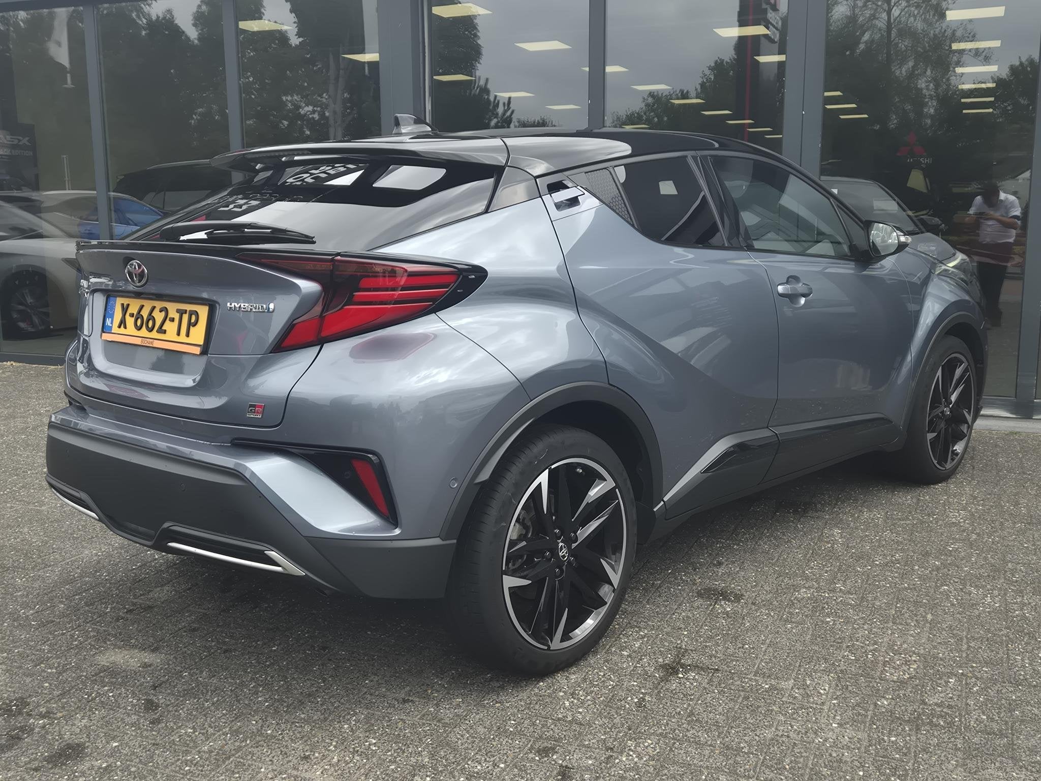 Toyota C-HR 1.8 Hybrid Executive | GR -Sport |, Auto's, 4 cilinders, Met garantie (alle), Leder en Stof, 122 pk