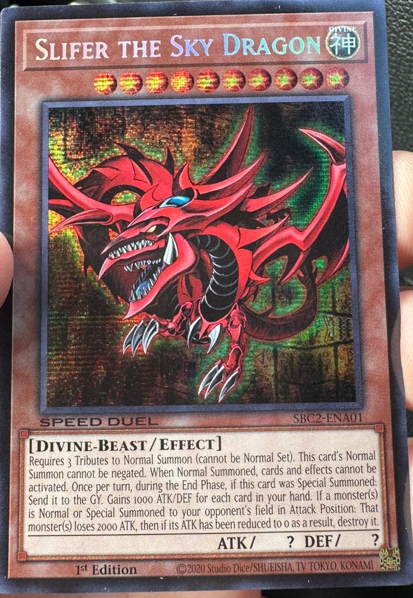 Yu-Gi-Oh! Slifer the Sky Dragon SBC2 1st Edition Duel Promo, Ophalen of Verzenden, Zo goed als nieuw, Losse kaart, Foil