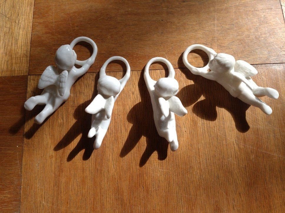 Set van 4 porseleinen engeltjes kaarshouders, Ophalen