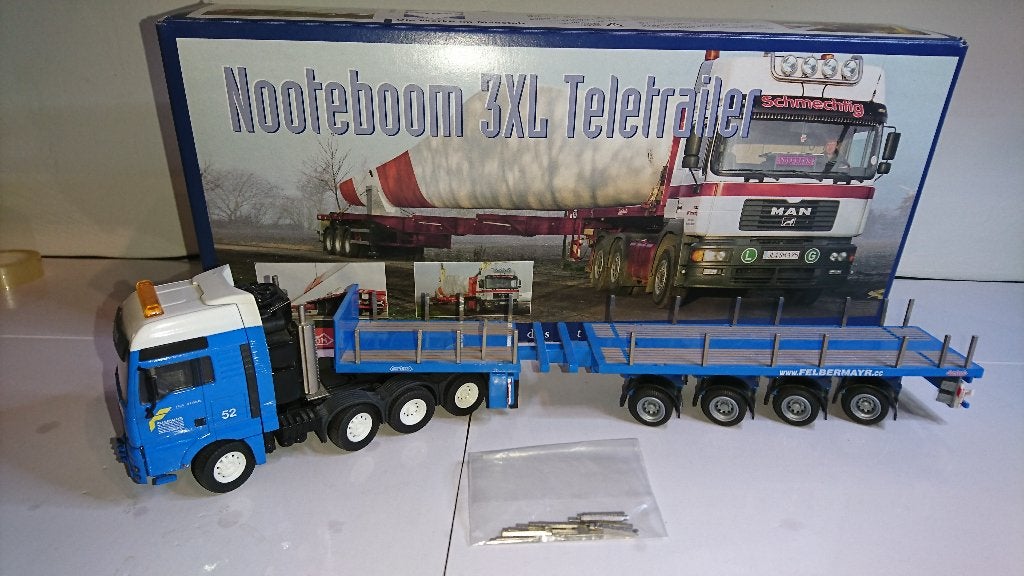 MAN TGA 8x4 Felbermayr Nooteboom 3XL teletrailer 1:50, Ophalen, Zo goed als nieuw, Bus of Vrachtwagen, Conrad