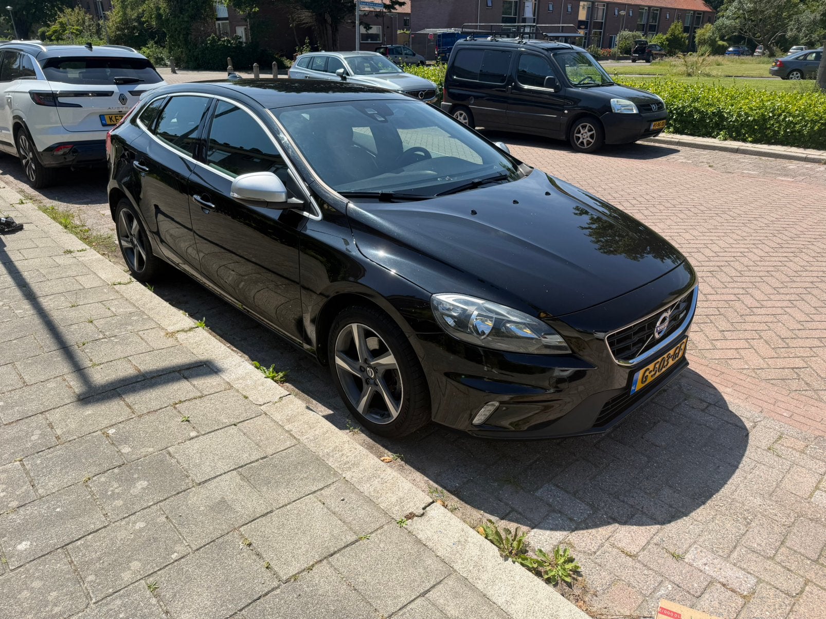 Volvo V40 2.0 T2 R-Design,  122PK 2015 Zwart, Auto's, Volvo, Voorwielaandrijving, Zwart, 4 cilinders, Leder en Stof