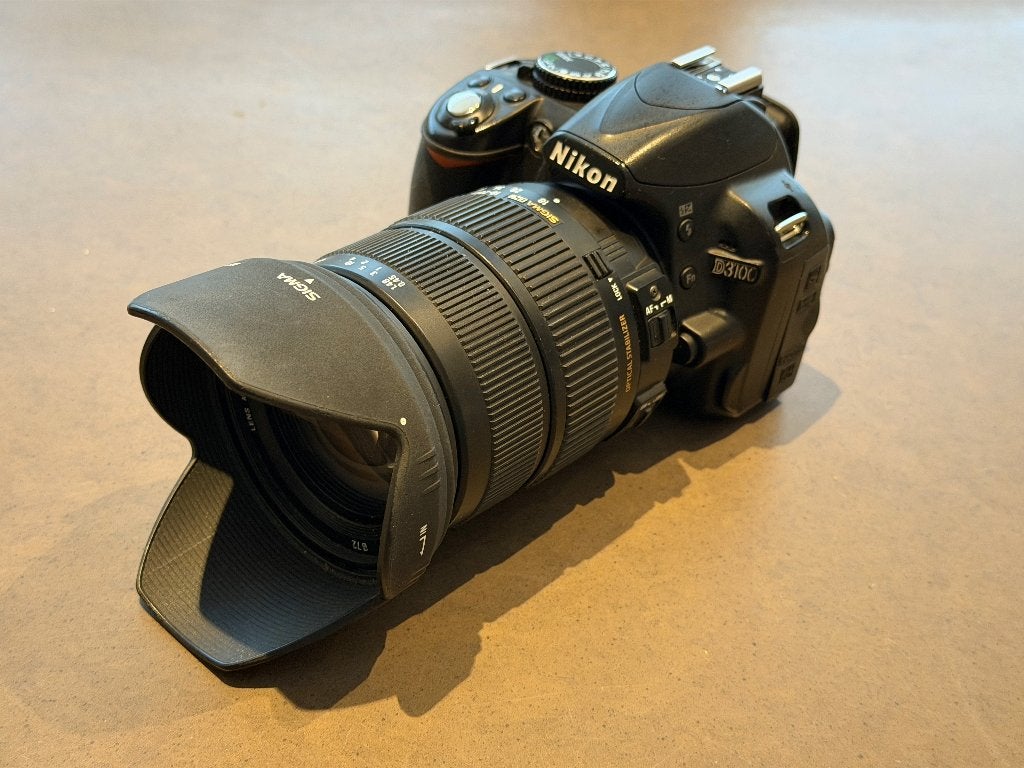 Nikon D3100 incl. 18-200mm Zoomlens, Spiegelreflex, Ophalen of Verzenden, Zo goed als nieuw, 24 megapixels