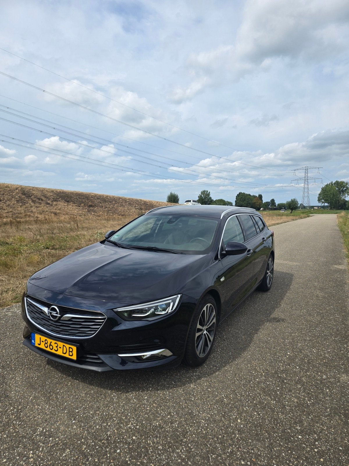 Opel Insignia 1.5 T Sport Tourer incl trekhaak, Auto's, Opel, Zwart, 4 cilinders, Blauw, Leder