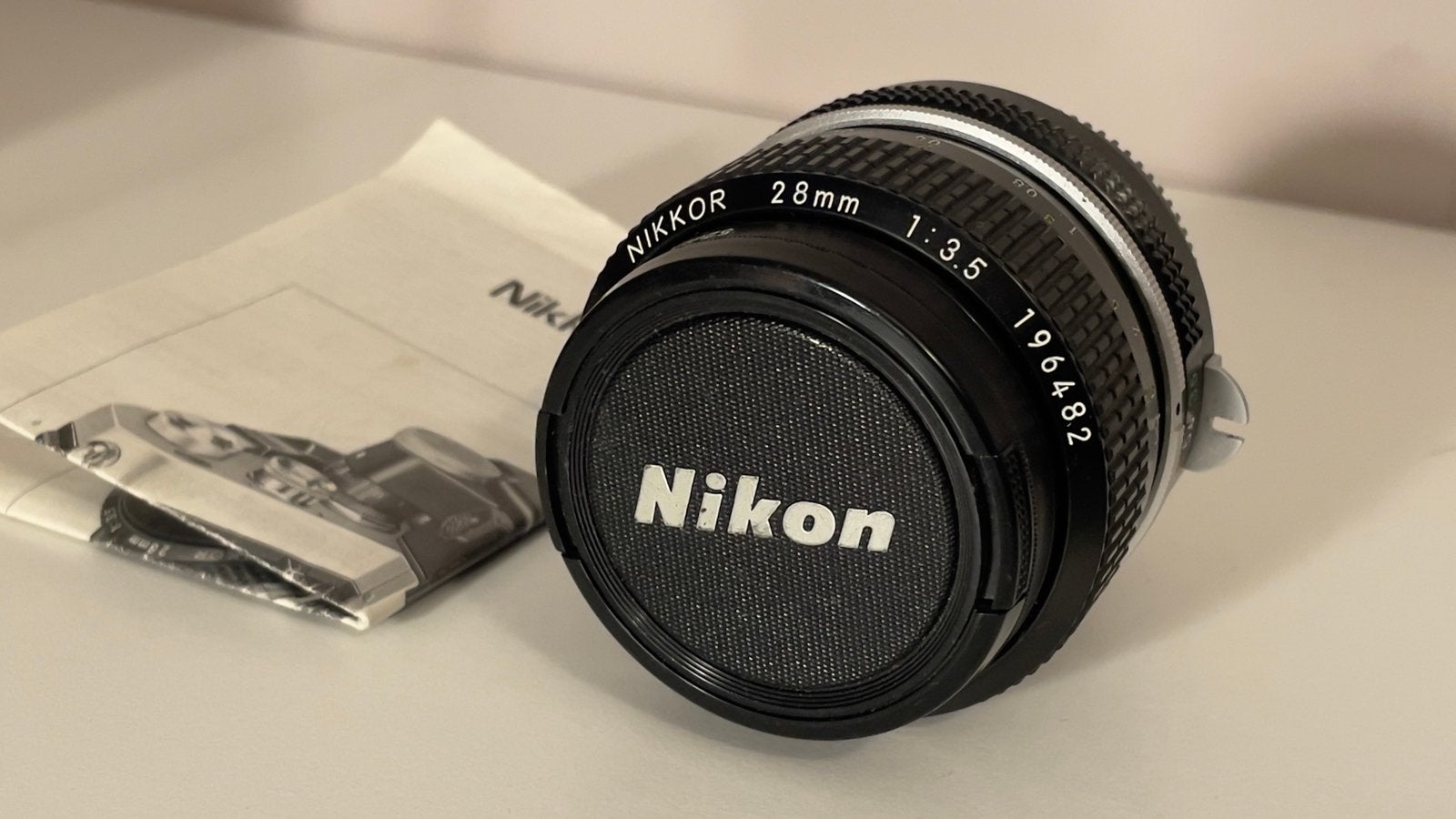 Nikkor 28mm f/3.5 non-AI lens met boekje, Audio, Tv en Foto, Gebruikt, Nikon, Nikon F-mount, Handmatige focus