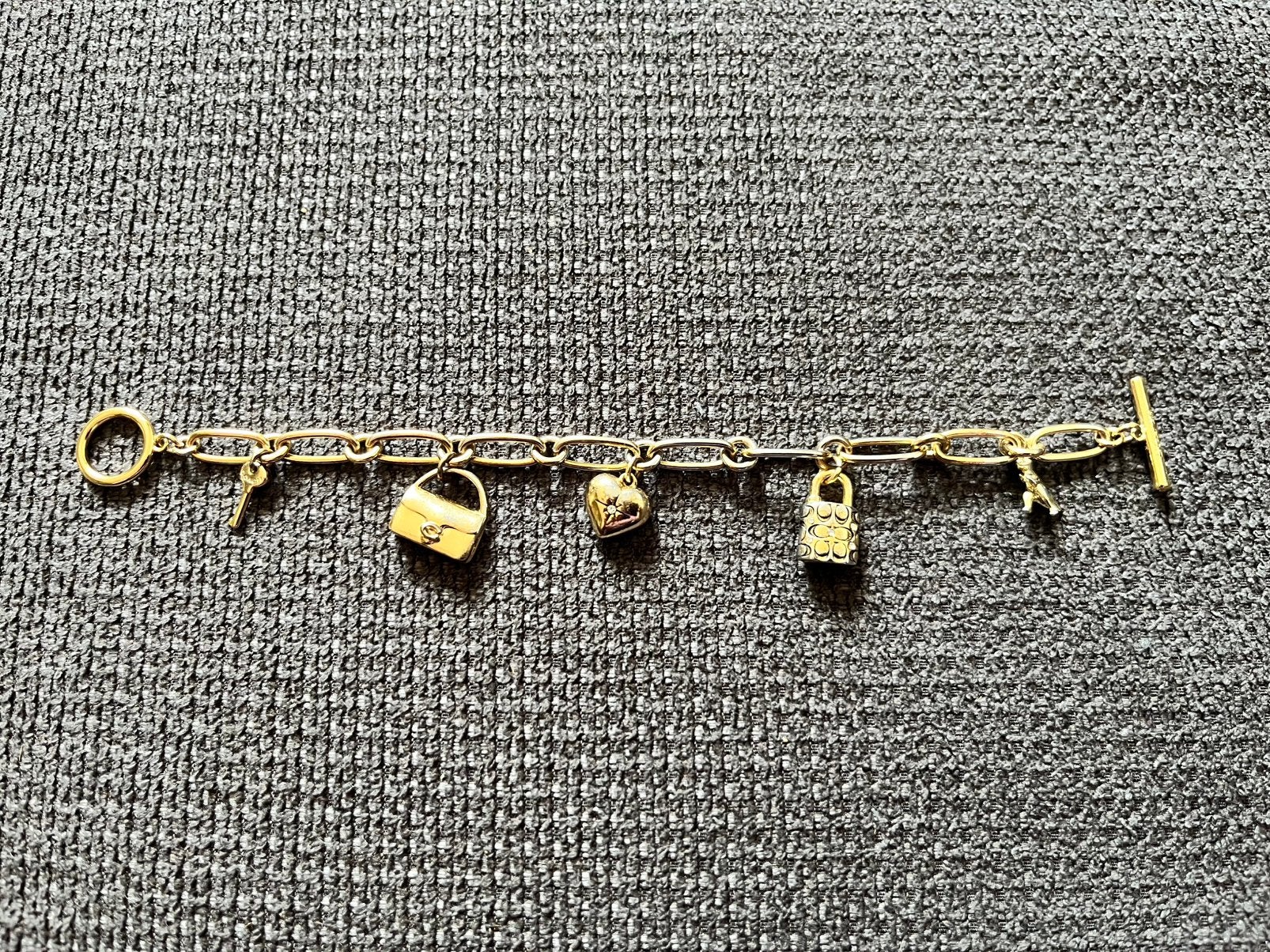 Bedelarmband van Coach, Sieraden, Tassen en Uiterlijk, Bedels, Overige merken, Overige materialen, Gebruikt, Ophalen of Verzenden
