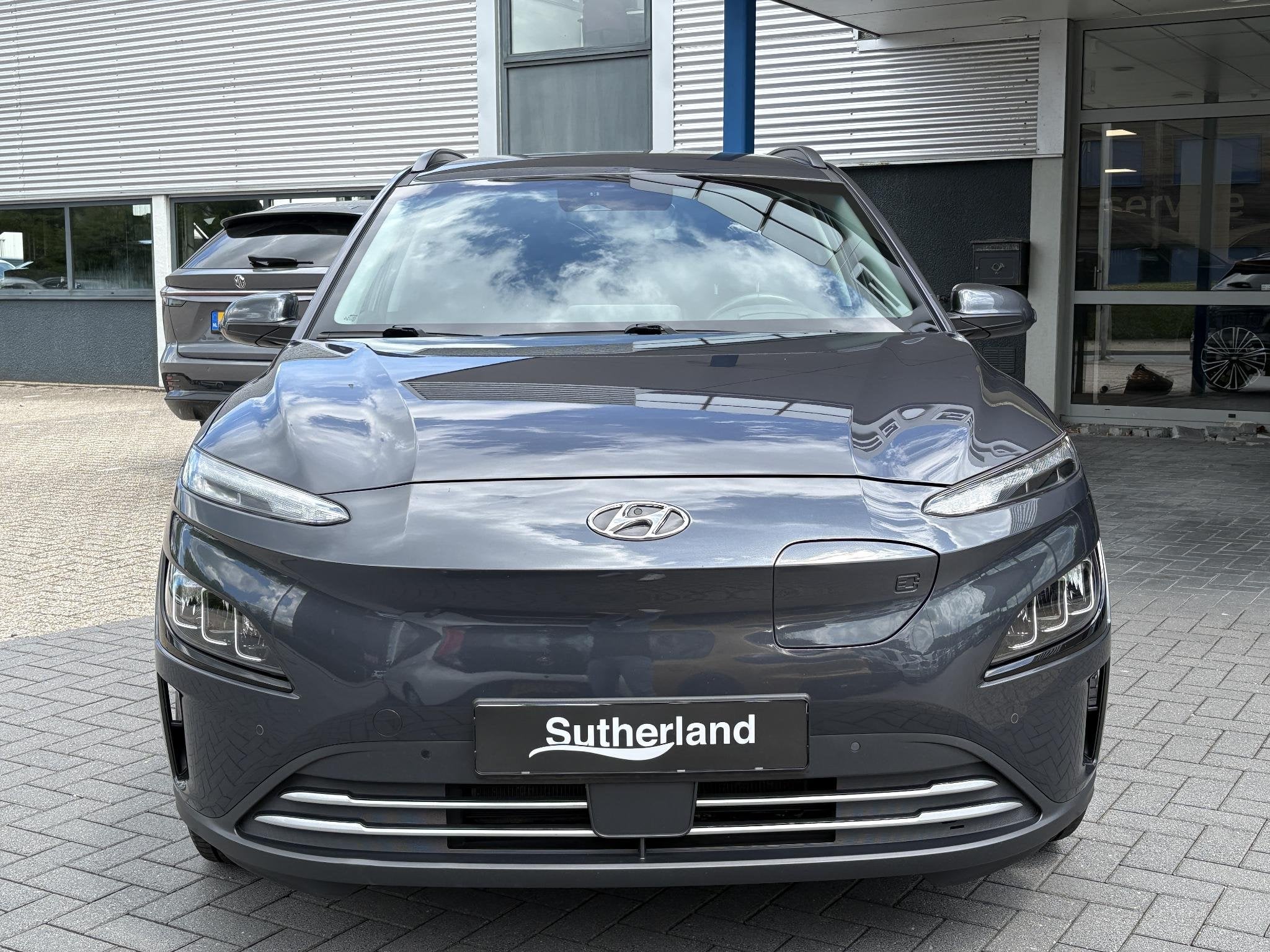 Hyundai Kona EV Fashion 64 kWh | SOH 95% | Head-Up | Krell A, Dealer onderhouden, Stof, Gebruikt, Automatische klimaatregeling