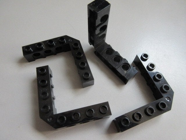 nr. 9864, 4 Zwarte technic hoekstenen, 32555 brick 5x5., Ophalen of Verzenden, Zo goed als nieuw, Losse stenen, Lego