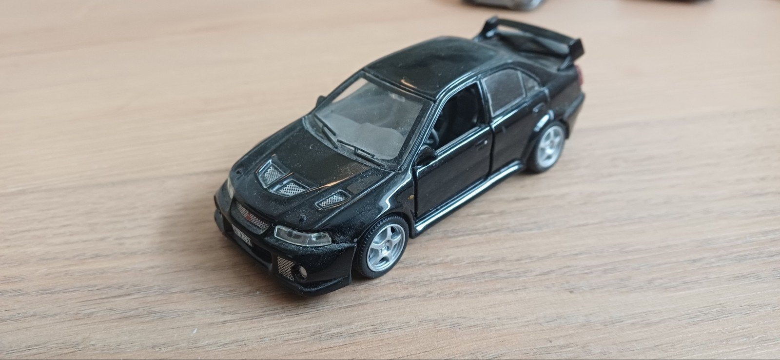 Zwarte Mitsubishi Lancer Evolution 5 (Rs) modelauto, Ophalen of Verzenden, Gebruikt, Auto, Overige merken
