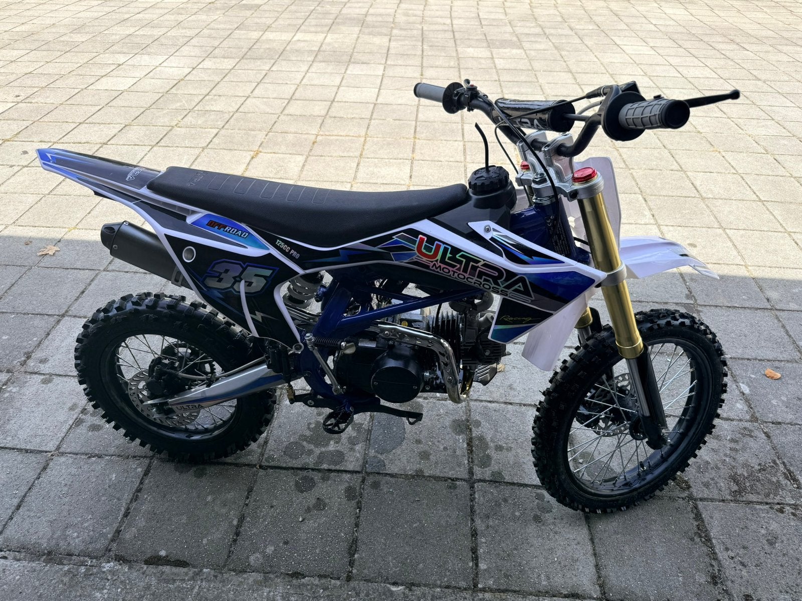 Ultra Motocross 125cc Pro in blauw/wit/zwart, Ophalen, Zo goed als nieuw, Overige merken