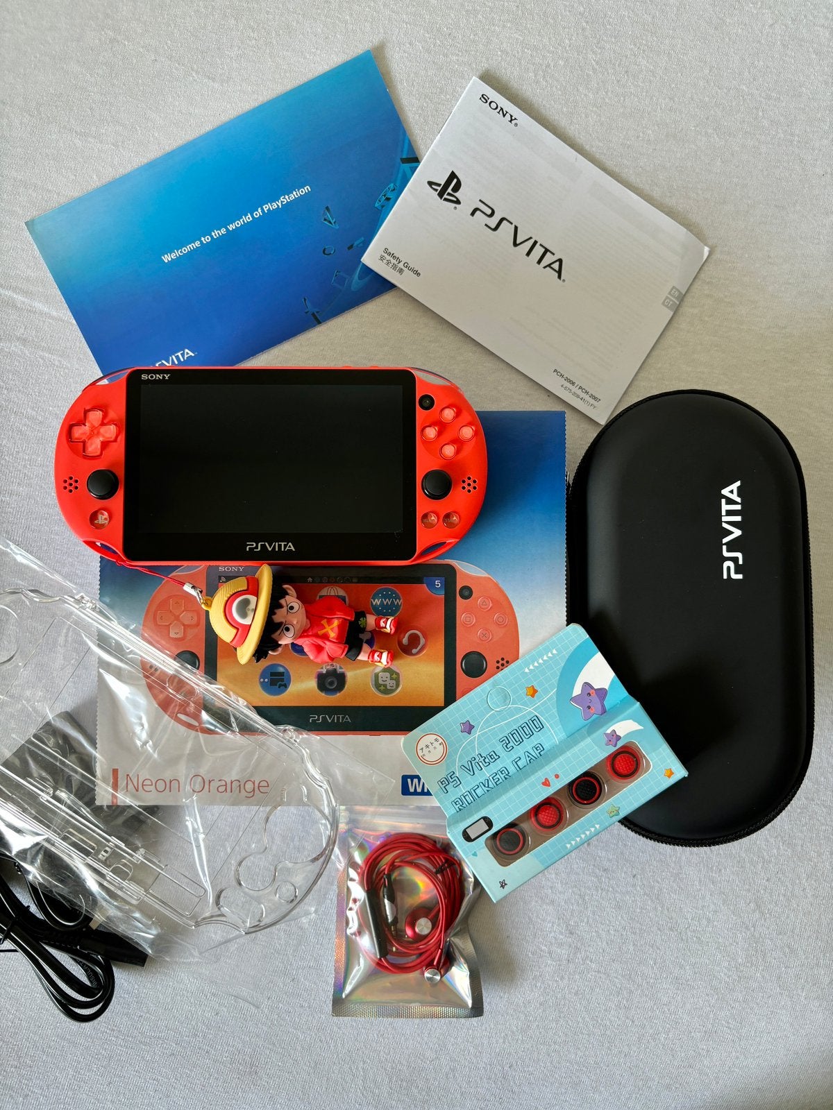 Sony PS Vita Slim 2000 Neon Orange 128GB Complete Set, Spelcomputers en Games, Ophalen of Verzenden, Zo goed als nieuw, Overige kleuren