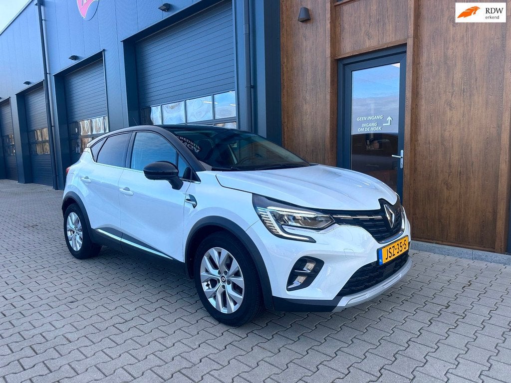 Renault Captur 1.6 E-Tech Hybrid 145 Intens l camera l parel, Auto's, Renault, 94 pk, Gebruikt, 715 kg, Leder en Stof