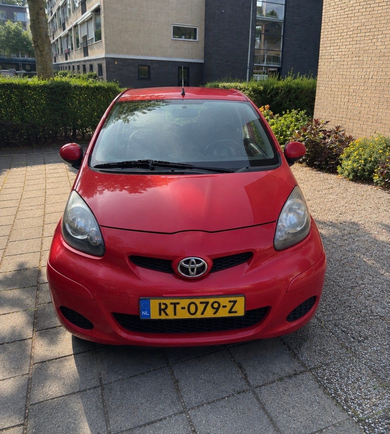 Zuinige Toyota Aygo 1.0 12V Vvt-i 5DRS 2009 Rood, Auto's, Voorwielaandrijving, 4 stoelen, 68 pk, Handgeschakeld