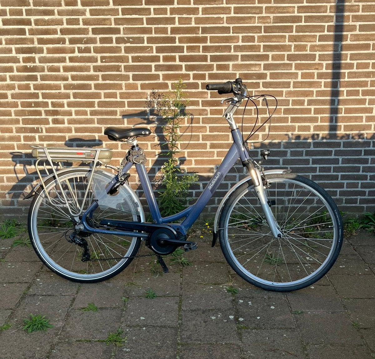 Middenmotor elektrische fiets Stella Allegra, Zo goed als nieuw, 59 cm of meer, 50 km per accu of meer, Ophalen