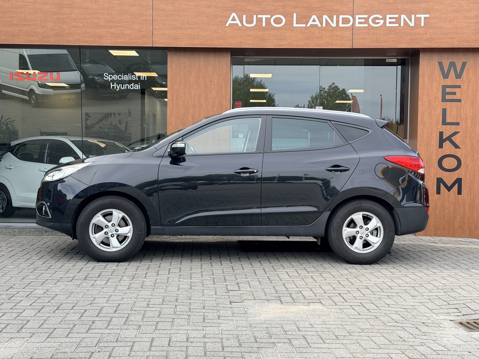 Hyundai ix35 2.0i Active | Radio | Stoel verwarming | Cruise, Gebruikt, Zwart, 4 cilinders, Leder en Stof