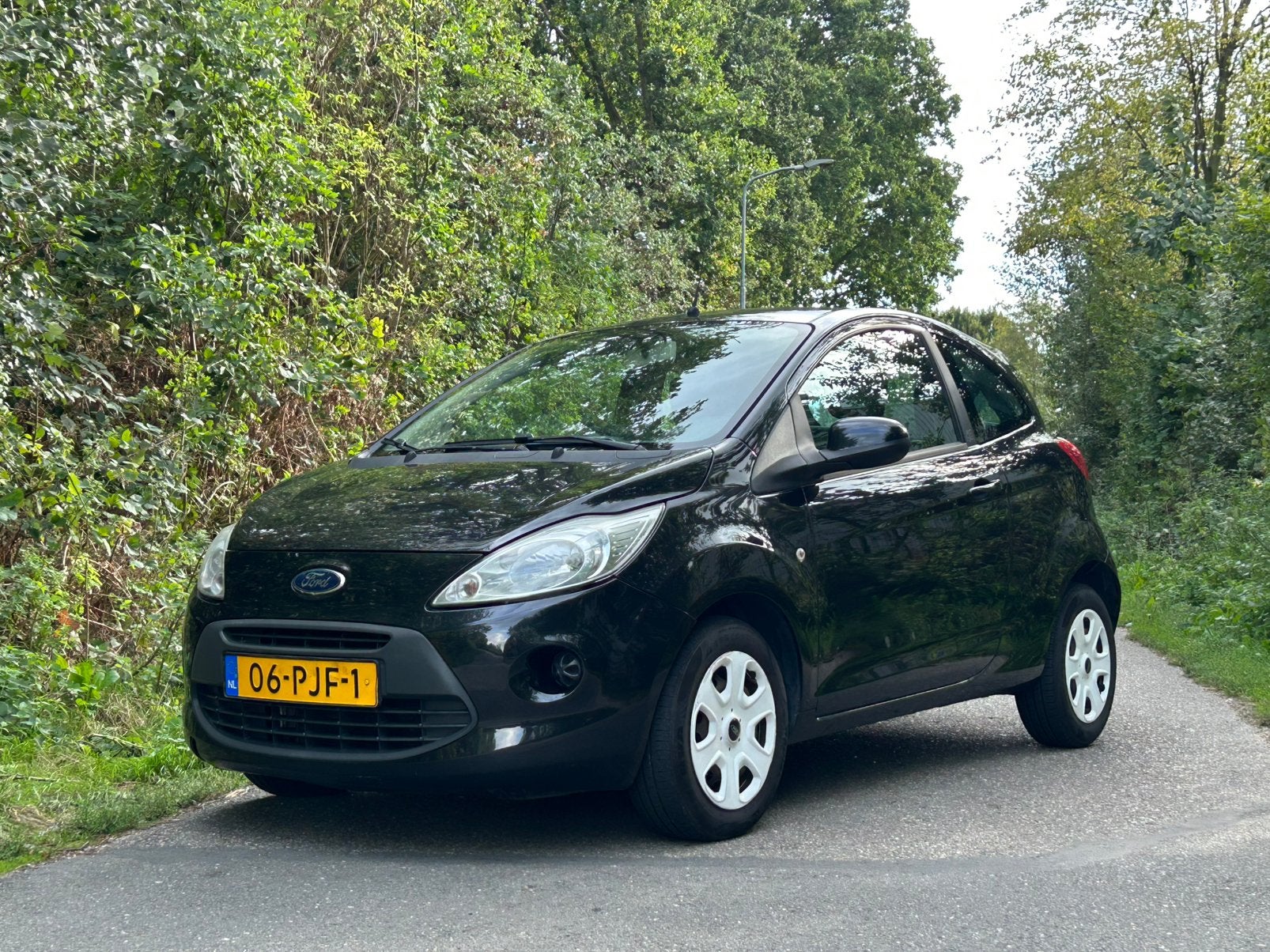Ford Ka 1.2 69pk 2011 Zwart Airco / APK 02/2027 / NAP, Auto's, Voorwielaandrijving, Stof, 1242 cc, 4 cilinders