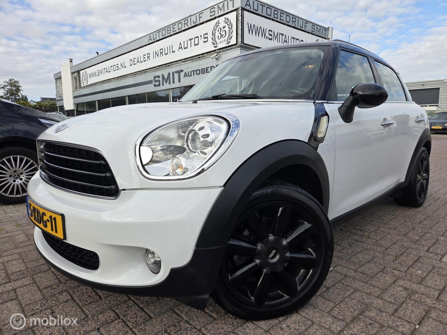 Mini Countryman 1.6 Cooper Holland Street Pano/Leder/Nav/Xen, Auto's, Voorwielaandrijving, Start-stop-systeem, Gebruikt, Bedrijf