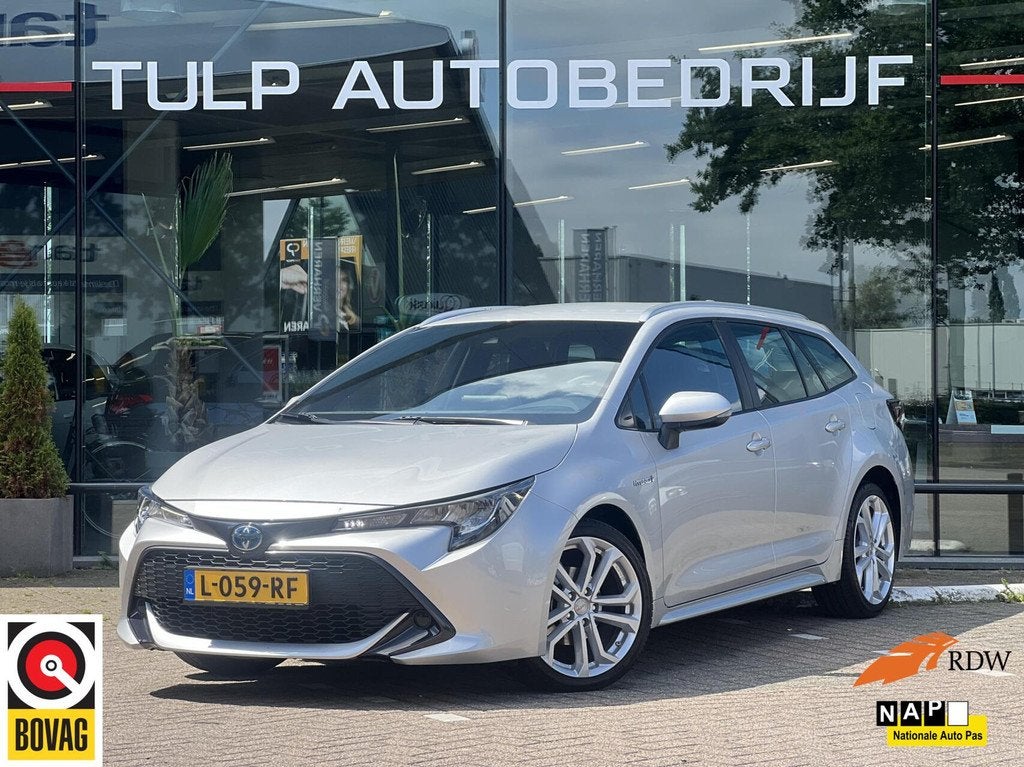 Toyota Corolla Touring Sports 1.8 Hybrid Active NLauto NAP, Auto's, 1345 kg, Gebruikt, 4 cilinders, Corolla