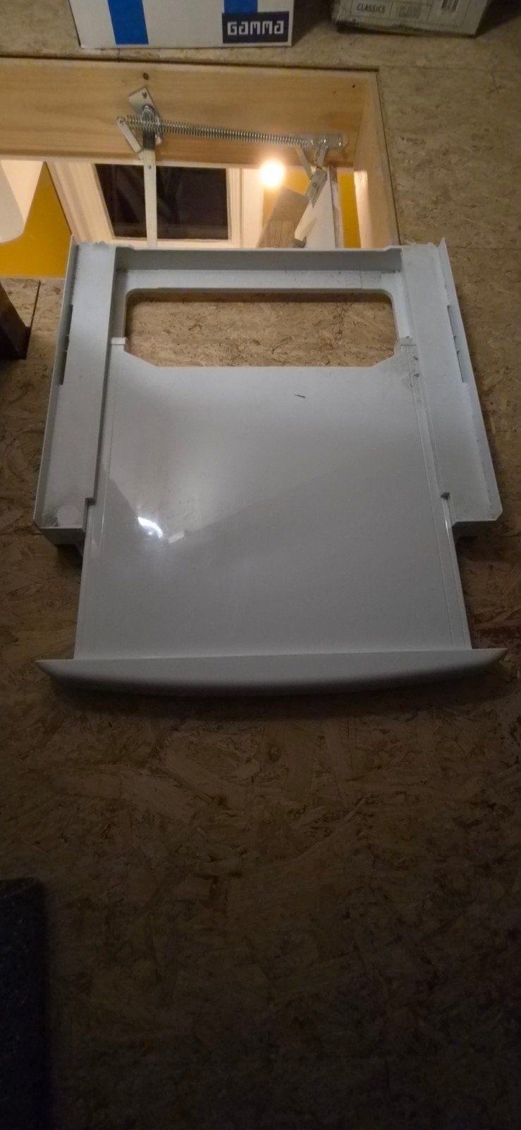 Lade voor tussen wasmachine en droger, Ophalen