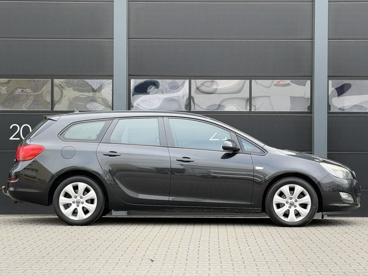 Opel Astra 1.7 CDTi Navi Airco PDC (bj 2012), 1686 cc, Zwart, Astra, 154 €/maand