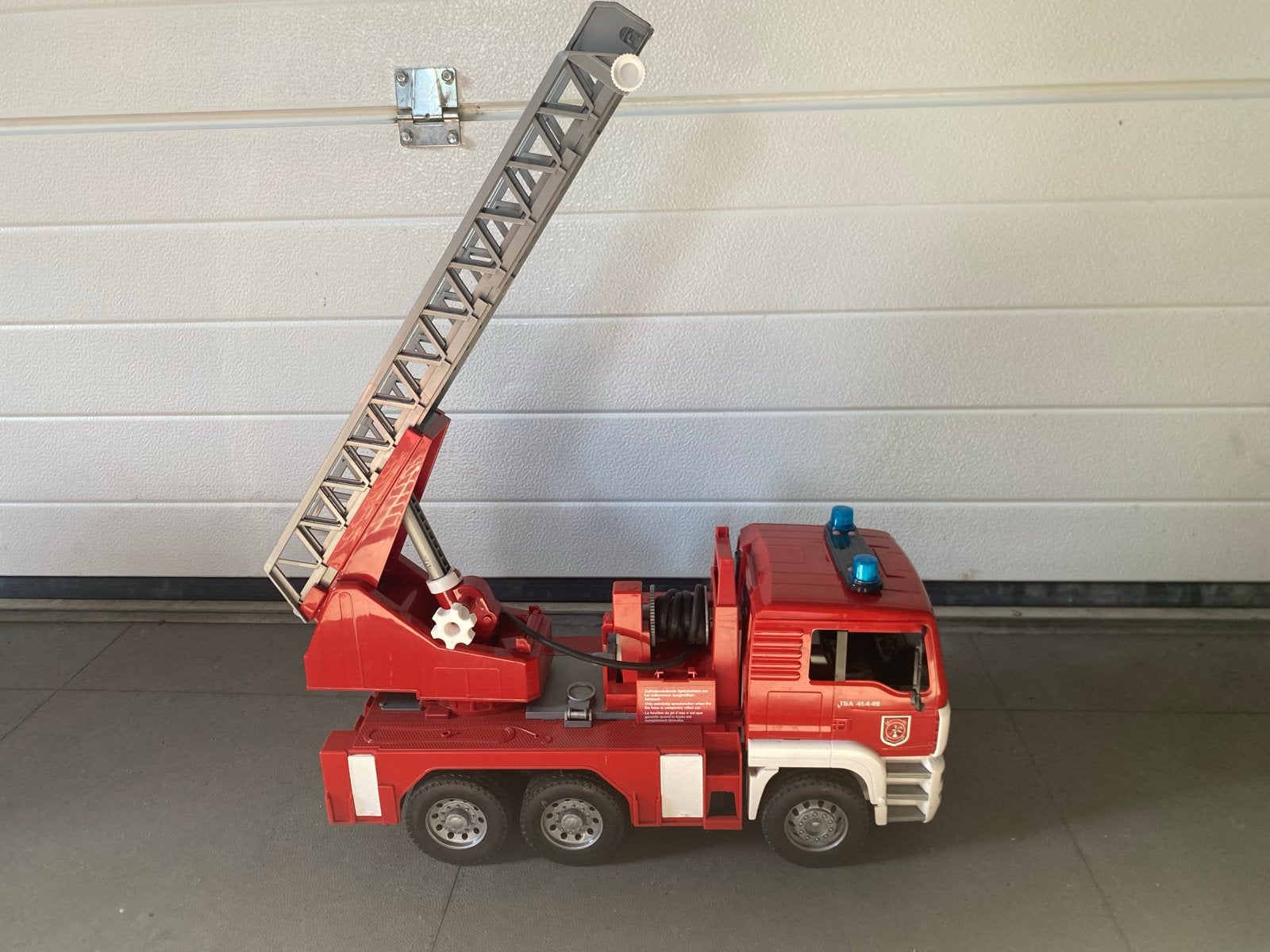 Bruder MAN Brandweerwagen met Ladder, Ophalen of Verzenden, Gebruikt