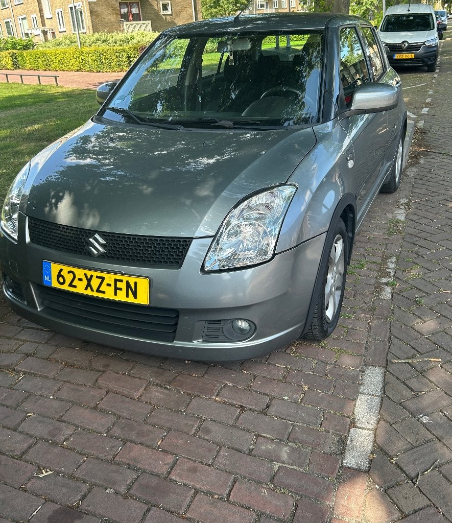 Suzuki Swift 1.5 5D AUT 2005 Grijs, Stof, 40 €/maand, Zwart, 4 cilinders