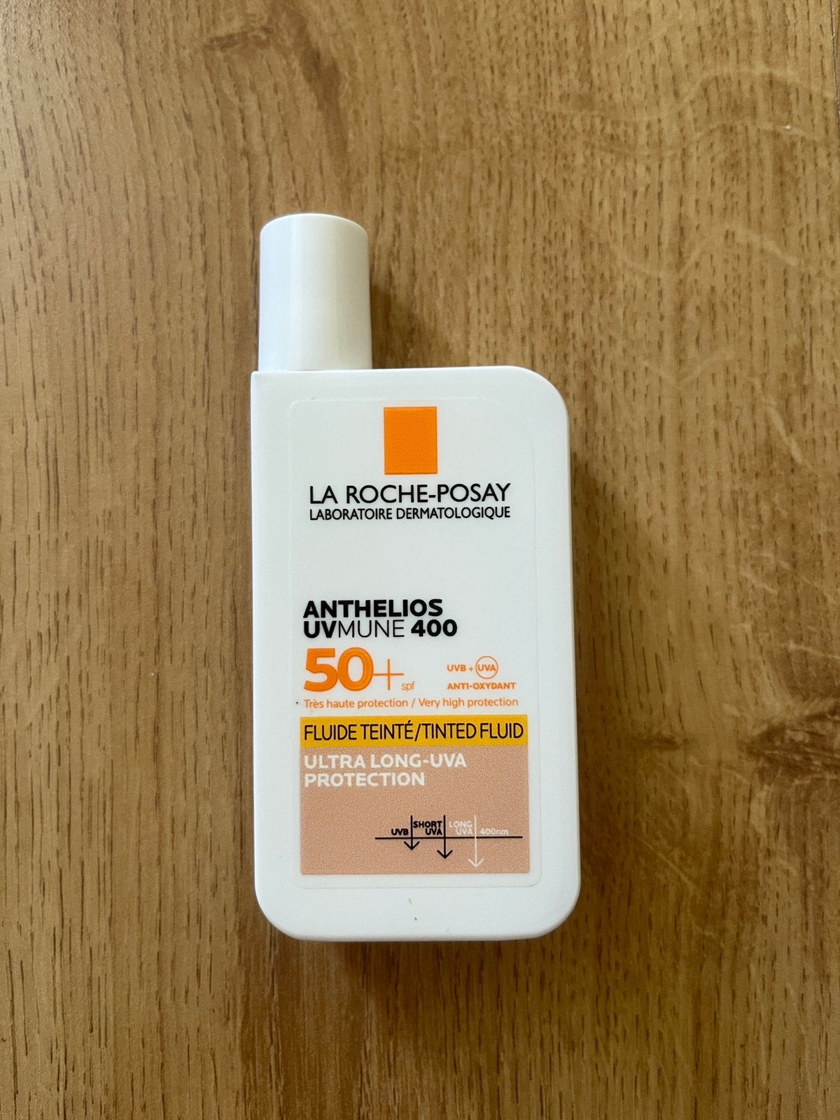 La Roche-Posay Anthelios UVMune 400 getinte fluid SPF50+, Ophalen of Verzenden, Nieuw, Gehele gezicht