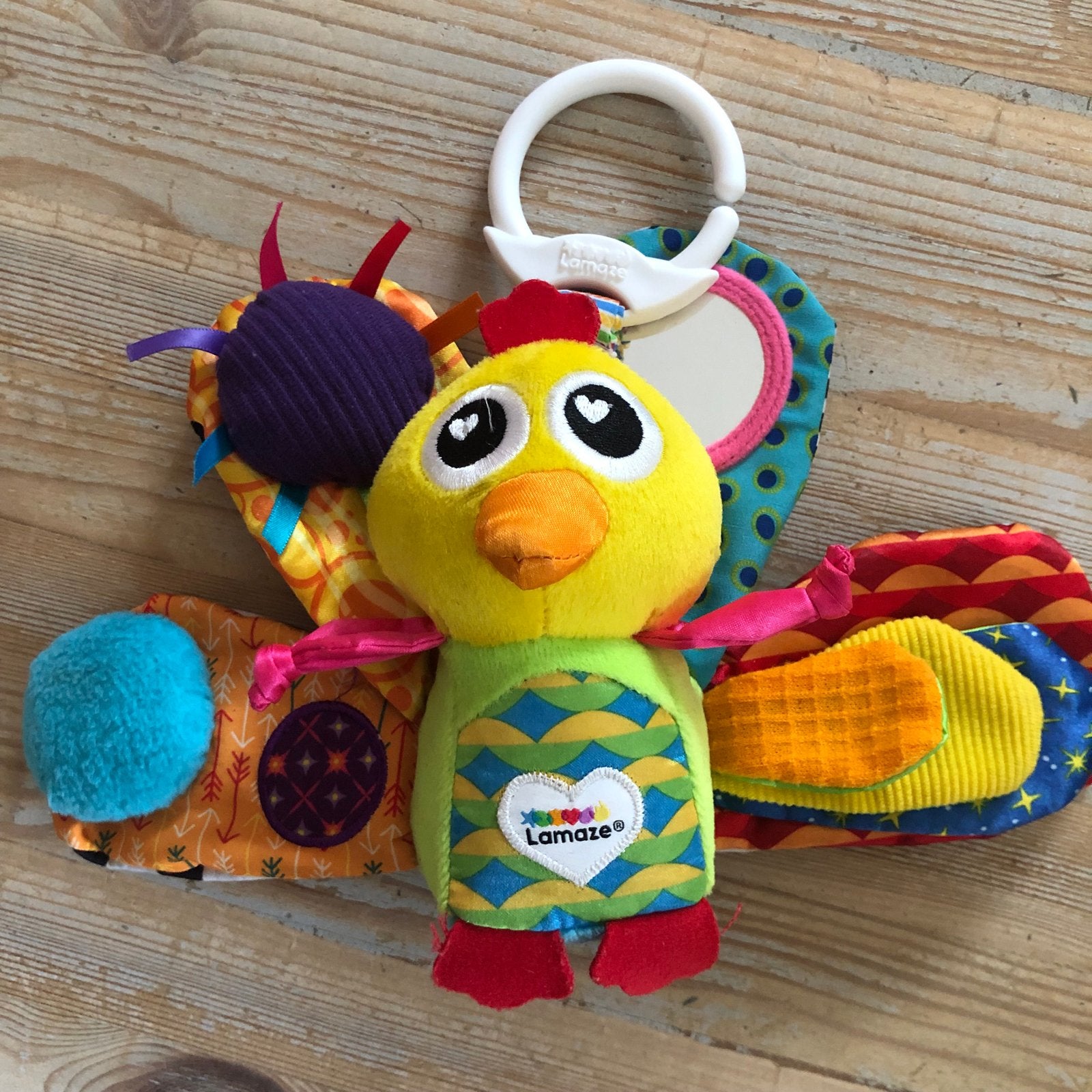 Lamaze pauw Knuffel hanger met Rammelaar en Spiegeltje, Ophalen of Verzenden, Zo goed als nieuw, Overige typen