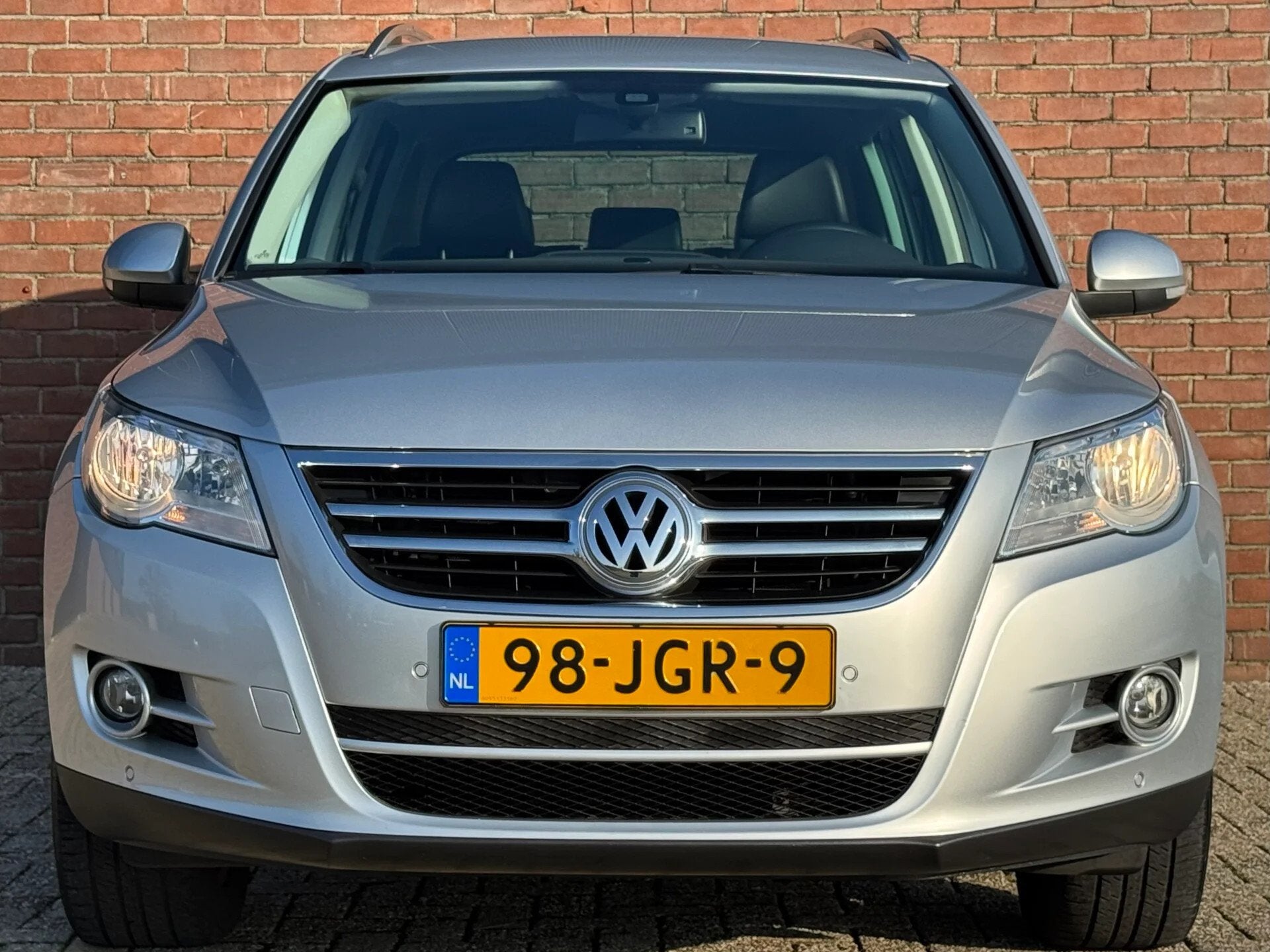 Volkswagen Tiguan 2.0 TSI | NL-AUTO! | LEDER! | NAVI!, Auto's, Automatische klimaatregeling, Gebruikt, Zwart, 4 cilinders
