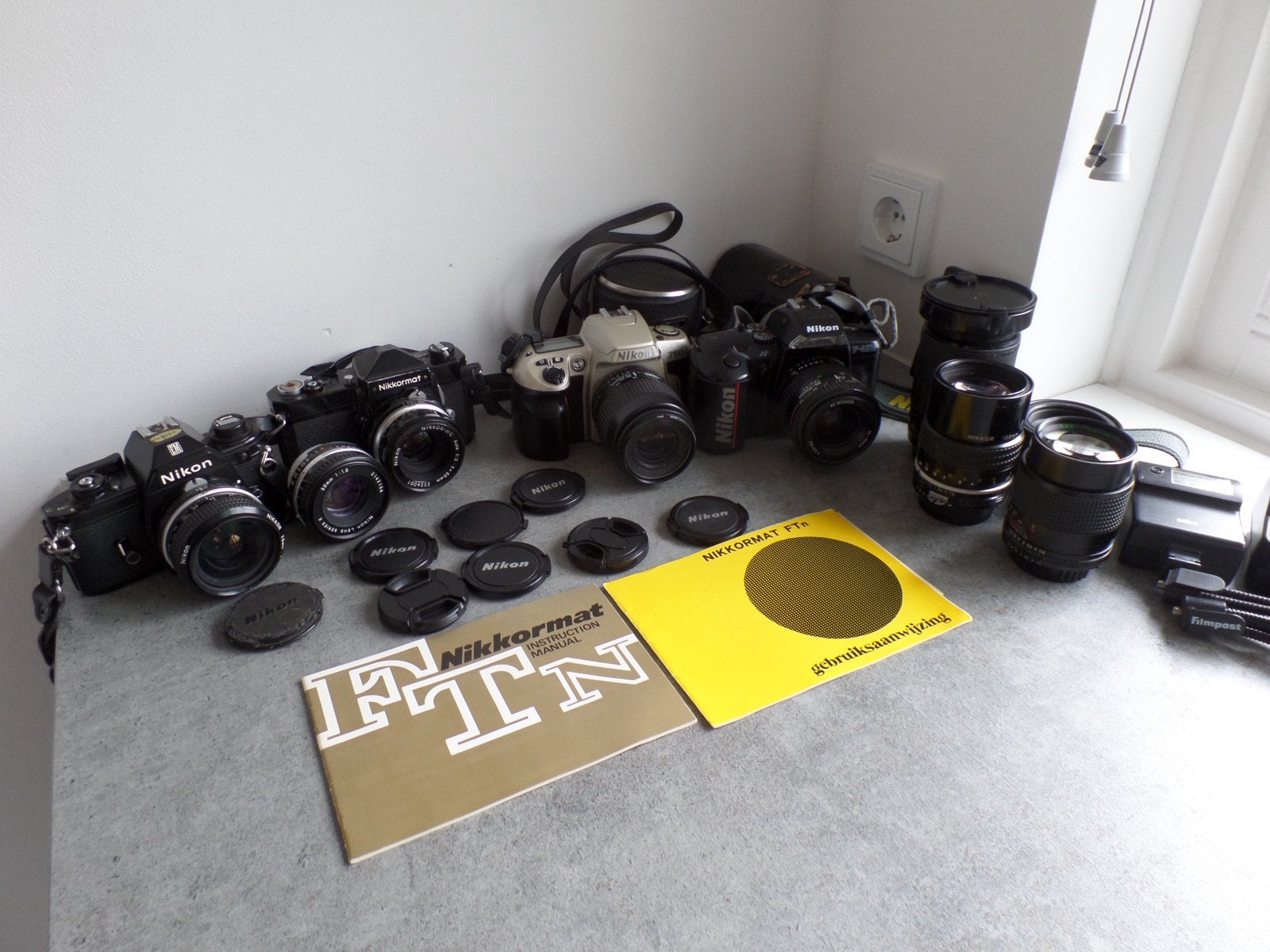 Complete Nikon verzameling Nikkormat, Nikon EM, Nikon lenzen, Ophalen of Verzenden, Gebruikt, Spiegelreflex, Nikon
