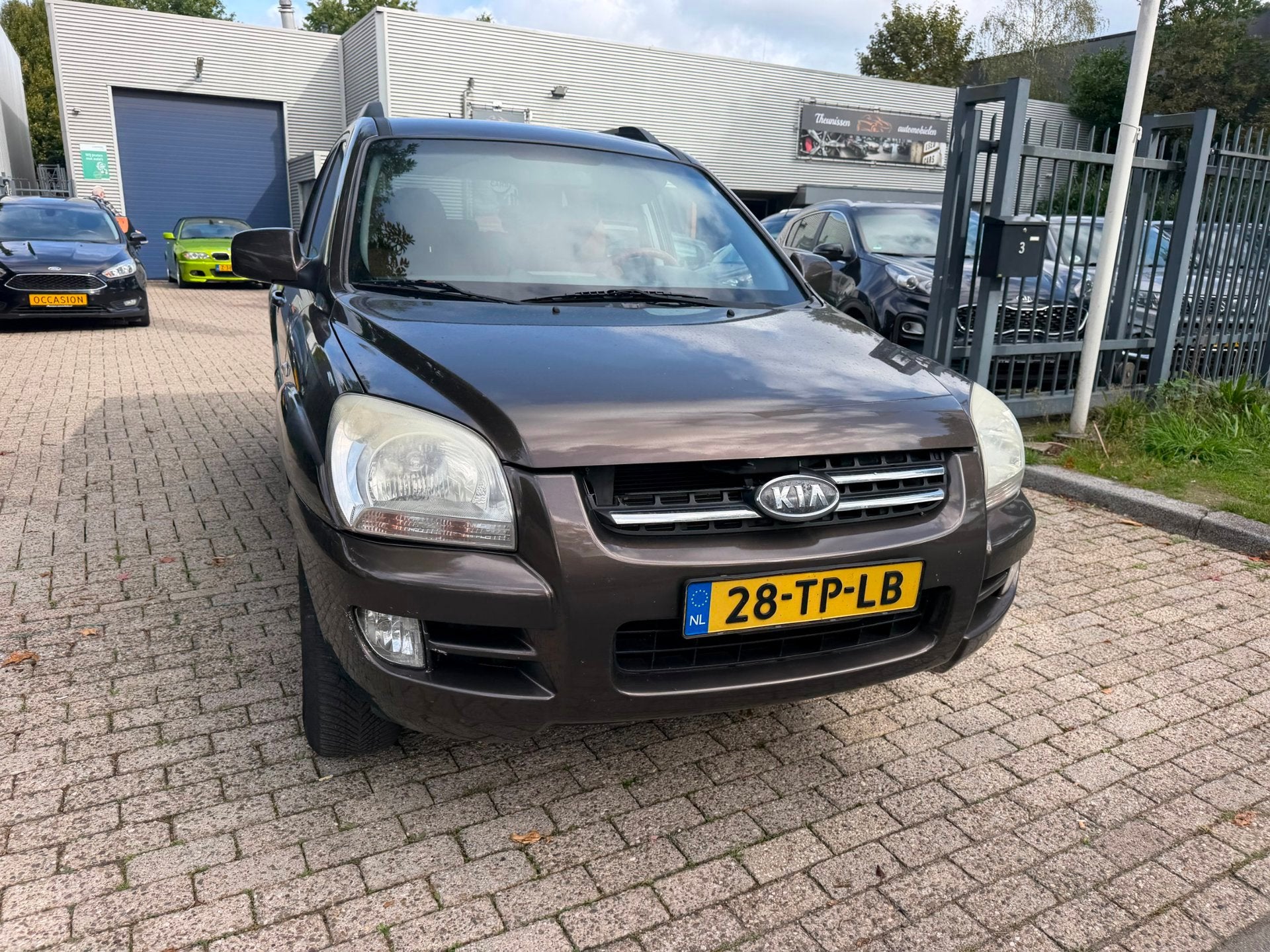Kia Sportage 2.7 V6 M-bition 4WD 235.603 km rijd perfect net, Auto's, Automaat, Gebruikt, Bruin, 2656 cc