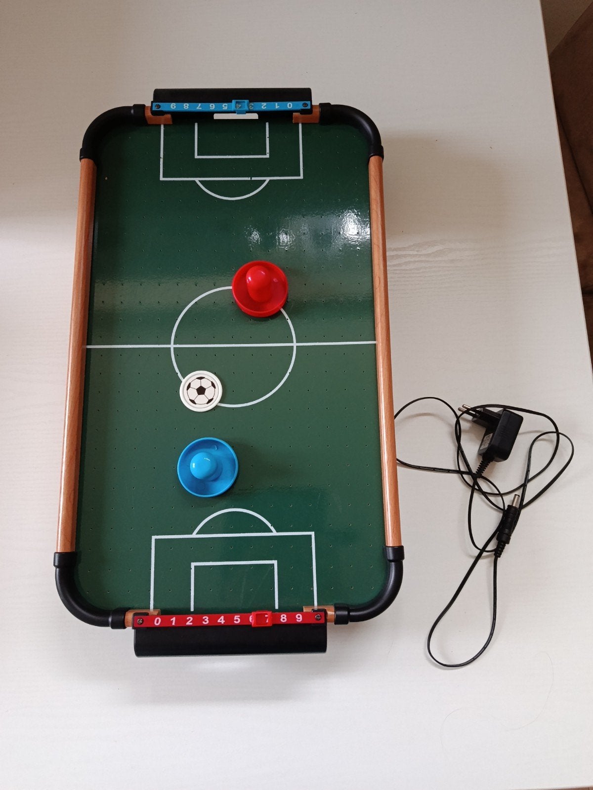 Mini Airhockey tafel, Ophalen