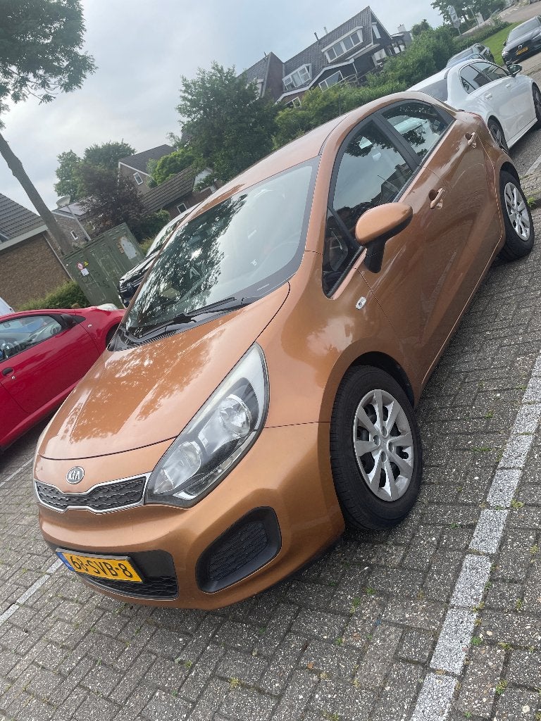 Kia Rio 1.2 I 5DRS 2011 Geel, Auto's, Euro 5, 4 cilinders, 49 €/maand, Handgeschakeld
