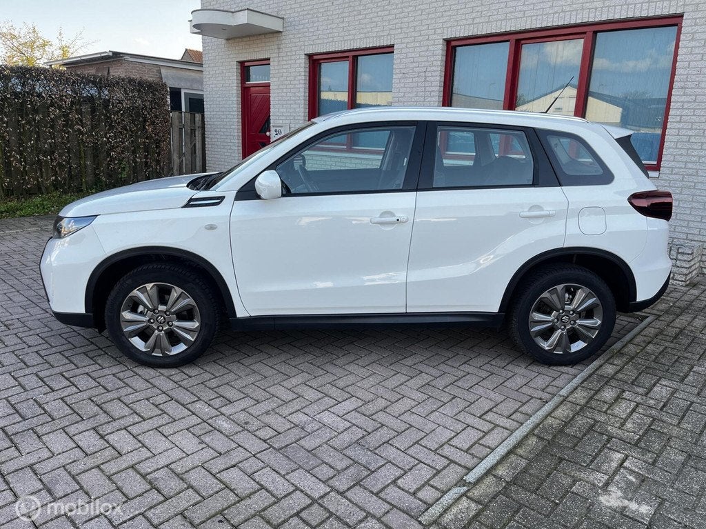 Suzuki Vitara 1.4 Boosterjet Comfort Smart Hybrid, Auto's, Voorwielaandrijving, Stof, Gebruikt, Zwart