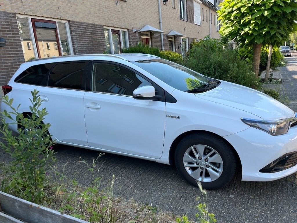 Toyota Auris 1.8 Hybrid Touring Sports CVT 2015 Wit, Auto's, Toyota, USB, Euro 6, Leder en Stof, Wit
