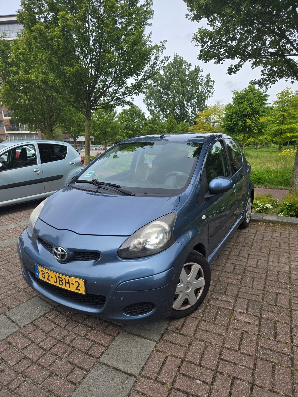 Toyota Aygo 1.0 12V Vvt-i 5DRS 2009 Blauw, Auto's, Voorwielaandrijving, Stof, Zwart, 68 pk