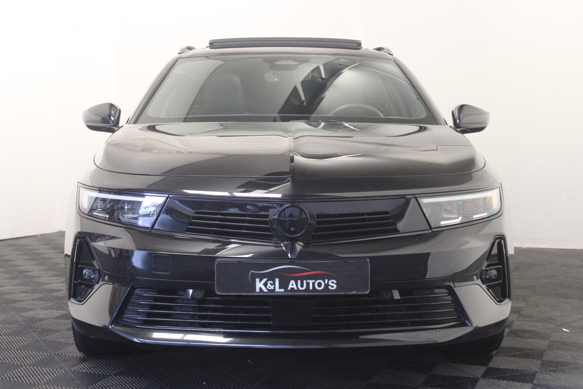 Opel Astra Sports Tourer 1.2 Turbo Hybrid Ultimate |Pano|Sto, Auto's, 1502 kg, Gebruikt, Zwart, 1199 cc